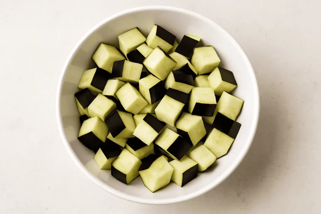 Prep the eggplant: Wash and dice the eggplant into bite-sized cubes. No need to peel.