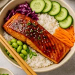 Assemble bowls: Add rice to bowls. Top with salmon and your favorite toppings. Drizzle extra sauce over everything.